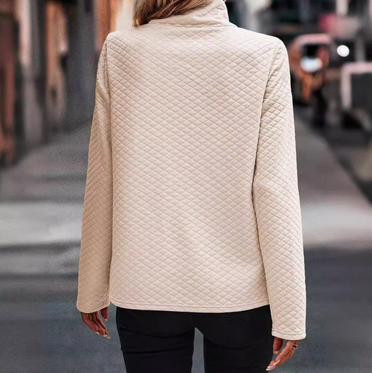 Long-sleeved top with quilted texture and raised collar