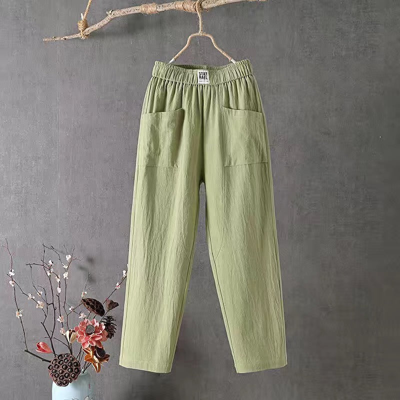 Straight-cut trousers with an elastic waistband and a simple design