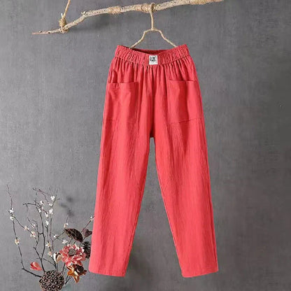 Straight-cut trousers with an elastic waistband and a simple design